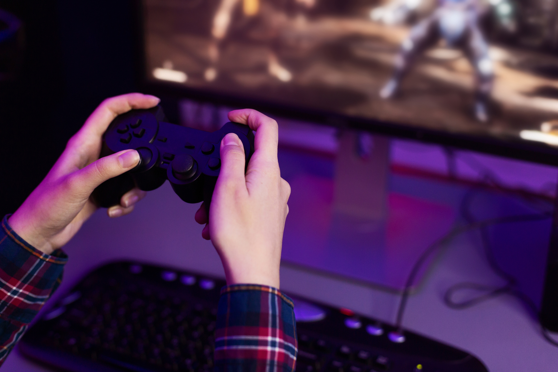 Gamer playing video game, holding joystick, free space